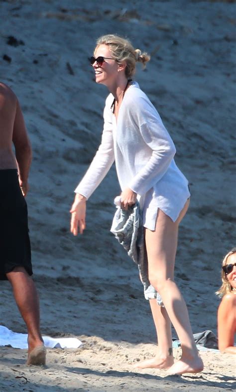 Charlize Theron puts her beach body on full display in sexy swimsuit